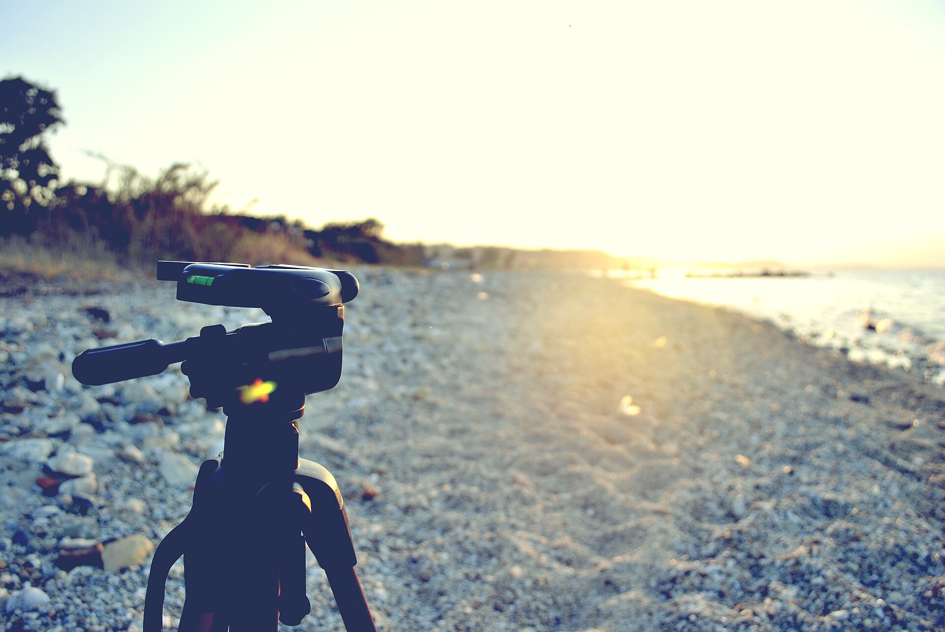 camera on tripod sunset